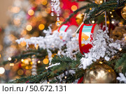 Magical Christmas background. Concept of preparation and decoration for the New Year. Holiday toys on the New Year's tree in Moscow. New Year's card 2026. Стоковое фото, фотограф Photojuli / Фотобанк Лори