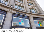 Microsoft flagship store exterior with colorful logo. London, UK, 11 May 2024. Редакционное фото, фотограф Zydrius Tartenis / Фотобанк Лори