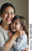 Close up side view overjoyed smiling young mother and daughter hugging and laughing, enjoying tender moment, happy mum and adorable preschool girl kid cuddling, having fun together. Стоковое AI-видео, аниматор Sergey Grishin / Фотобанк Лори