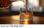 splash pouring liquid into glass. Стоковое фото, фотограф Vectorwin / Фотобанк Лори