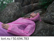 Woman in the taiga forest and rocks of the Stolby nature reserve park. Стоковое фото, фотограф Jan Jack Russo Media / Фотобанк Лори