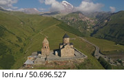 Gergeti Trinity church near mount Kazbek (2022 год). Стоковое видео, видеограф Михаил Коханчиков / Фотобанк Лори