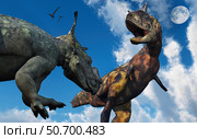 A Pachyrhinosaurus confronting a Carnotaurus. Стоковое фото, фотограф Mark Stevenson/Stocktrek Images / ТАСС / Фотобанк Лори