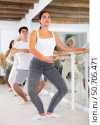 Young woman doing choreography at ballet barre. Стоковое фото, фотограф Яков Филимонов / Фотобанк Лори
