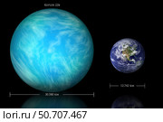 Artist's depiction of the difference in size between Earth and Kepler 22b. Стоковое фото, фотограф Marc Ward/Stocktrek Images / ТАСС / Фотобанк Лори