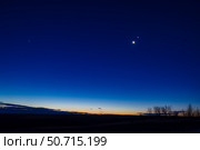 The waning crescent Moon in conjunction with Venus in the dawn twilight. Стоковое фото, фотограф Alan Dyer/Stocktrek Images / ТАСС / Фотобанк Лори
