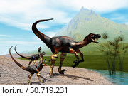 Velociraptor offspring beg mother dinosaur for food near a pond. Стоковое фото, фотограф Corey Ford/Stocktrek Images / ТАСС / Фотобанк Лори