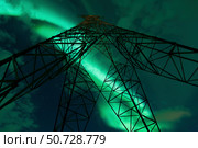 Powerlines and aurora borealis, Tjeldsundet, Norway. Стоковое фото, фотограф Arild Heitmann/Stocktrek Images / ТАСС / Фотобанк Лори