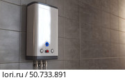 compact water heater tankless. Стоковое фото, фотограф Vectorwin / Фотобанк Лори