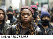 Young woman leading protest march for social justice. Стоковое AI-изображение, AI-художник Иван Рябоконь / Фотобанк Лори