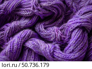 Close up of tangled purple yarn, showcasing its texture and the craftsmanship of knitting. Стоковое AI-изображение, AI-художник Иван Рябоконь / Фотобанк Лори