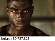 Portrait of sweaty determined black athlete resting after intense workout. Стоковое AI-изображение, AI-художник Иван Рябоконь / Фотобанк Лори