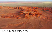 Bayanzag flaming cliffs at sunset in Mongolia. Стоковое фото, фотограф Михаил Коханчиков / Фотобанк Лори