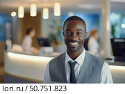 Portrait of happy black hotel concierge smiling at reception desk. Стоковое AI-изображение, AI-художник Иван Рябоконь / Фотобанк Лори
