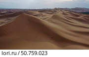 Aerial view of sand dunes in desert at sunset. Стоковое фото, фотограф Михаил Коханчиков / Фотобанк Лори
