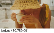 Woman smiling while enjoying cappuccino in a cafe in Amalfi towm Italy. Стоковое видео, видеограф Igor Tichonow / Фотобанк Лори