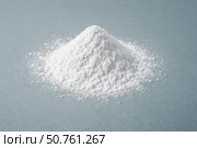 Closeup white powder mound on grey table, soft loose texture, chemical substance for food, medicine, cosmetic, laboratory, baking, cleaning. Стоковое AI-изображение, AI-художник Павел Муравьев / Фотобанк Лори