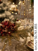 Christmas table setting with champagne glasses and Christmas decorations. Selective focus. Стоковое фото, фотограф Оксана Шведкова / Фотобанк Лори