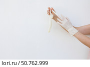 Female hands wearing disposable gloves. Стоковое фото, фотограф Акимова Надежда / Фотобанк Лори