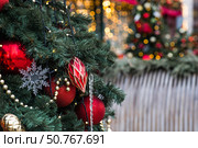 New Year's card 2026. Fabulous Christmas background. Festive toys on the New Year tree in Moscow. The concept of preparing and decorating for the new year. Стоковое фото, фотограф Photojuli / Фотобанк Лори