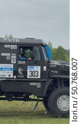 ANGARSK, IRKUTSK REGION, RUSSIA - July 13, 2025: XV International Silk Way Rally, racing competition. Vertical video of famous team of champions on sports truck №303 KAMAZ-master before start in rainy summer day. Редакционное видео, видеограф Виктория Катьянова / Фотобанк Лори