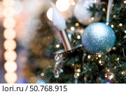 Beautiful Christmas background 2026.Abstract blurred Christmas background with Christmas tree garlands in warm shades. Стоковое фото, фотограф Photojuli / Фотобанк Лори