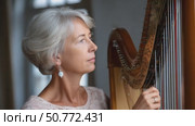 Elegant musician playing harp, six moments of musical grace. Стоковое AI-видео, аниматор Юрий Поздников / Фотобанк Лори