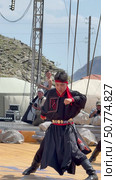 ELANTSY, IRKUTSK REGION, RUSSIA - July 5, 2025: Erdynskie Games - festival of nomadic peoples of Eurasia. Vertical video of Buryat youths in national costumes dancing fiery folk dance on open stage. Редакционное видео, видеограф Виктория Катьянова / Фотобанк Лори