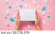 Hands Holding Blank Box Amidst Pastel Paper Crumple: Gift, Mockup, Branding. Стоковое AI-изображение, AI-художник Данила Большаков / Фотобанк Лори