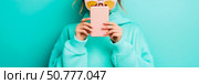Stylish Woman Concealing Face with Smartphone and Sunglasses, Teal Background. Стоковое AI-изображение, AI-художник Данила Большаков / Фотобанк Лори