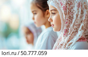 Young Girl in Headscarf: A Portrait of Faith and Innocence. Стоковое AI-изображение, AI-художник Данила Большаков / Фотобанк Лори