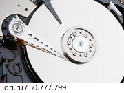 Close-up of the mechanism of a disassembled computer hard disk. Стоковое фото, фотограф Андрей С / Фотобанк Лори