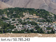 Exploring the scenic beauty of Urmetan village in Tajikistan amidst the mountains. Стоковое фото, фотограф Михаил Пряхин / Фотобанк Лори