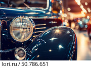 Classic car shining at a vintage car show. Стоковое AI-изображение, AI-художник Иван Рябоконь / Фотобанк Лори