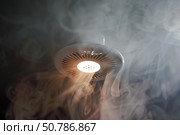 Smoke detector sensing smoke and triggering alarm system in home. Стоковое AI-изображение, AI-художник Иван Рябоконь / Фотобанк Лори
