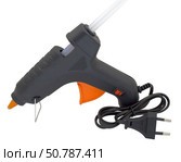 Клеевой пистолет на белом фоне. Electric hot glue gun isolated on white background. Стоковое фото, фотограф Татьяна Д / Фотобанк Лори