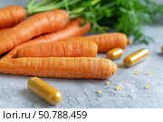Fresh carrots with beta carotene capsule promoting healthy vision and skin. Стоковое AI-изображение, AI-художник Иван Рябоконь / Фотобанк Лори