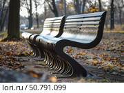 Modern benches standing in city park during autumn season. Стоковое AI-изображение, AI-художник Иван Рябоконь / Фотобанк Лори
