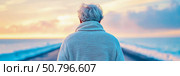 Elderly Person Contemplating Ocean Sunset: A Serene Scene. Стоковое AI-изображение, AI-художник Данила Большаков / Фотобанк Лори