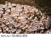 Drone view of the small town with white houses and surrounding countryside, Ojen, Spain in the summer (2022 год). Стоковое фото, фотограф Яков Филимонов / Фотобанк Лори
