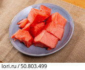 In plate there is small portion of watermelon pulp, useful cubes. Стоковое фото, фотограф Яков Филимонов / Фотобанк Лори