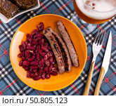 Sausages with red beans, typical Catalan dish butifarra con alubias. Стоковое фото, фотограф Яков Филимонов / Фотобанк Лори