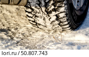 A car on a winter studded road on a snowy road. Стоковое фото, фотограф Igor Skripachev / Фотобанк Лори