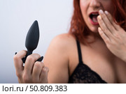 Excited woman in underwear holds a anal plug. Стоковое фото, фотограф Михаил Решетников / Фотобанк Лори