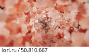 Himalayan pink salt is fallingin a super slow motion. Pink Himalayan salt is up to twenty times more expensive than table or sea salt. Shot on super slow motion camera 1000 fps. Стоковое видео, видеограф Андрей Армягов / Фотобанк Лори