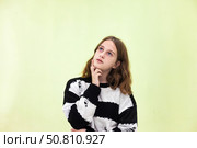 Teen Actress Expresses Deep Emotions in a Thoughtful Indoor Moment. Стоковое фото, фотограф Aleksandr Golubev / Фотобанк Лори