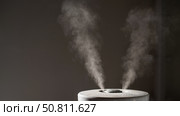 Close-up of steam from an air humidifier in a living room. Стоковое фото, фотограф Михаил Решетников / Фотобанк Лори