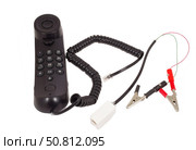 Телефонная трубка с зажимами на белом фоне. Telephone handset with clips on white background. Стоковое фото, фотограф Татьяна Д / Фотобанк Лори