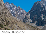 Ala-Archa Park, jagged mountains, rocky ridges, steep inclines, alpine landscape, patches of snow, dry grass, remote wilderness, challenging terrain, ideal for mountaineering, backcountry expeditions. Стоковое фото, фотограф Андрей Ка / Фотобанк Лори