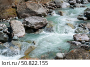 Ala-Archa Park, Clear glacial Whitewater river cascades, rocky mountain valley. Boulders, representing pristine nature, outdoor exploration and challenging backcountry travel routes. Стоковое фото, фотограф Андрей Ка / Фотобанк Лори